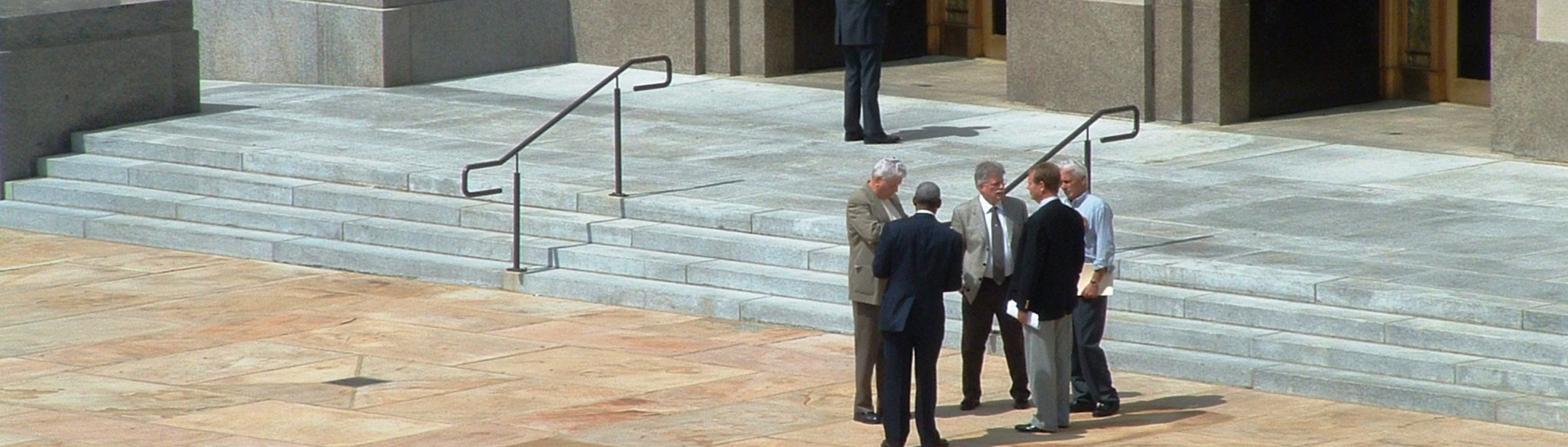 Businessmen talking while standing